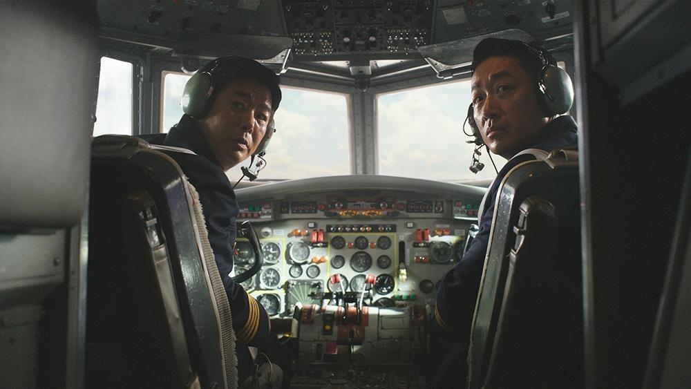 actors Sung Dong-il and Ha Jung-woo as the two pilots in the new Korean action-thriller 'Hijack 1971'.