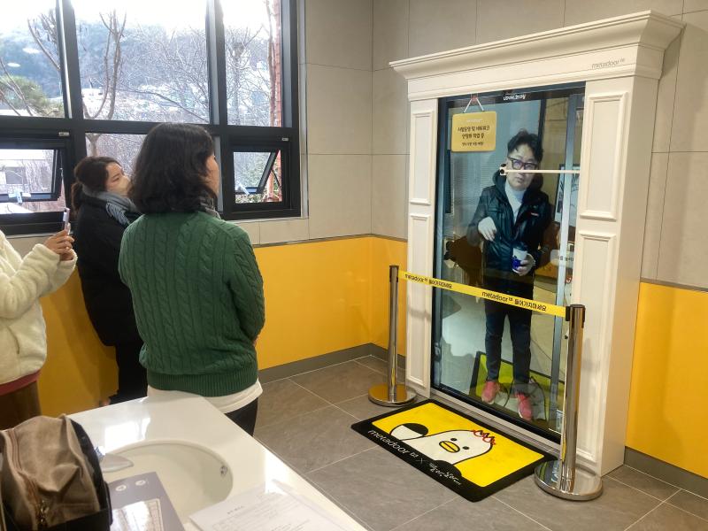 Users interacting with each other through meta door