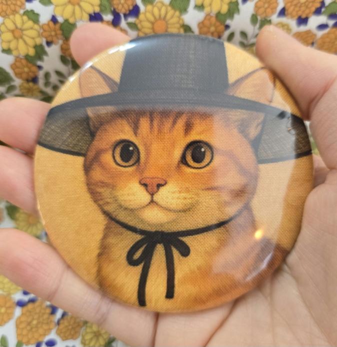 A hand mirror featuring the Gat Cat character, demonstrating the expansion of our original character IP into everyday lifestyle goods.