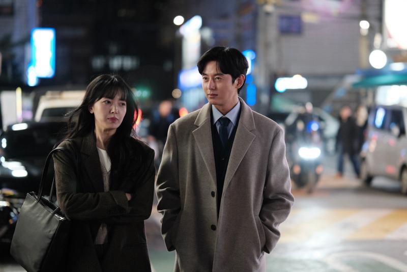Still image from The Client of Temptation, showing Min-young and Daniel walking together.