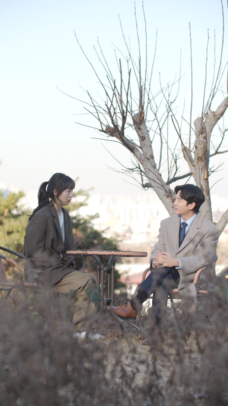 Still image from The Client of Temptation, featuring Min-young and Daniel opening up to each other during the investigation.