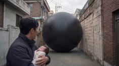 Hae Jun clutches a newborn baby as a colossal black orb blocks the narrow alley before him. The mysterious entity silently absorbs every human it detects, leaving no chance of escape. Faced with an impossible choice between survival and sacrifice, Hae Jun must protect the infant while searching for a way past the relentless force.