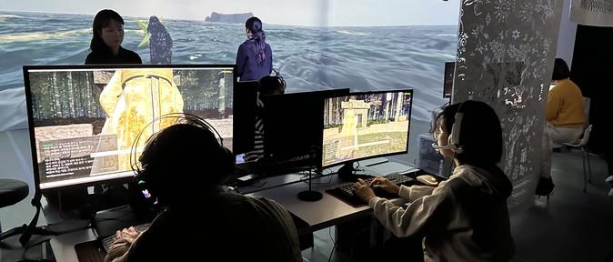 Visitors interact with the AI Simbang through curved monitors and projection walls in the Gime-decorated experience zone